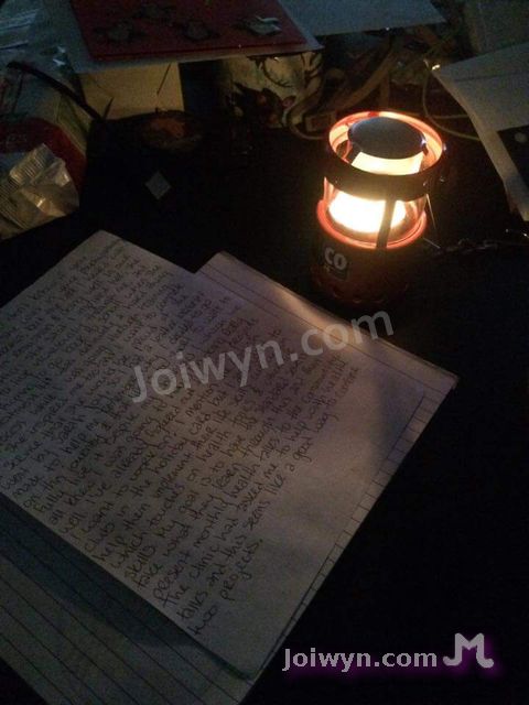 Candle and letter on table